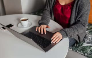 kaboompics A brunette woman works with a laptop and a phone 1