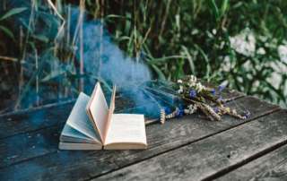 kaboompics Colorful smoke bomb book and vintage camera